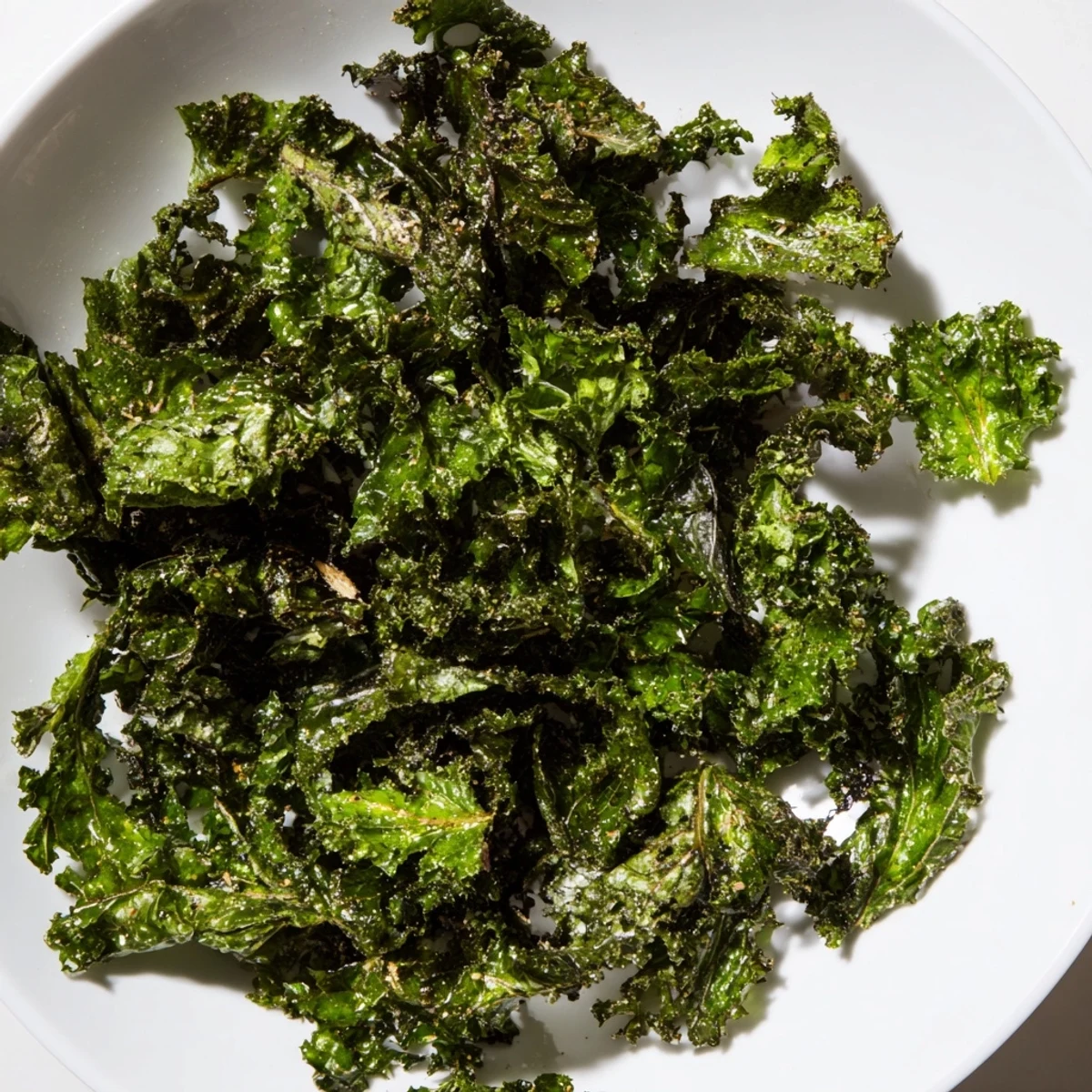 Golden, crispy kale chips baked until perfectly crunchy and lightly seasoned for a yummy snack.