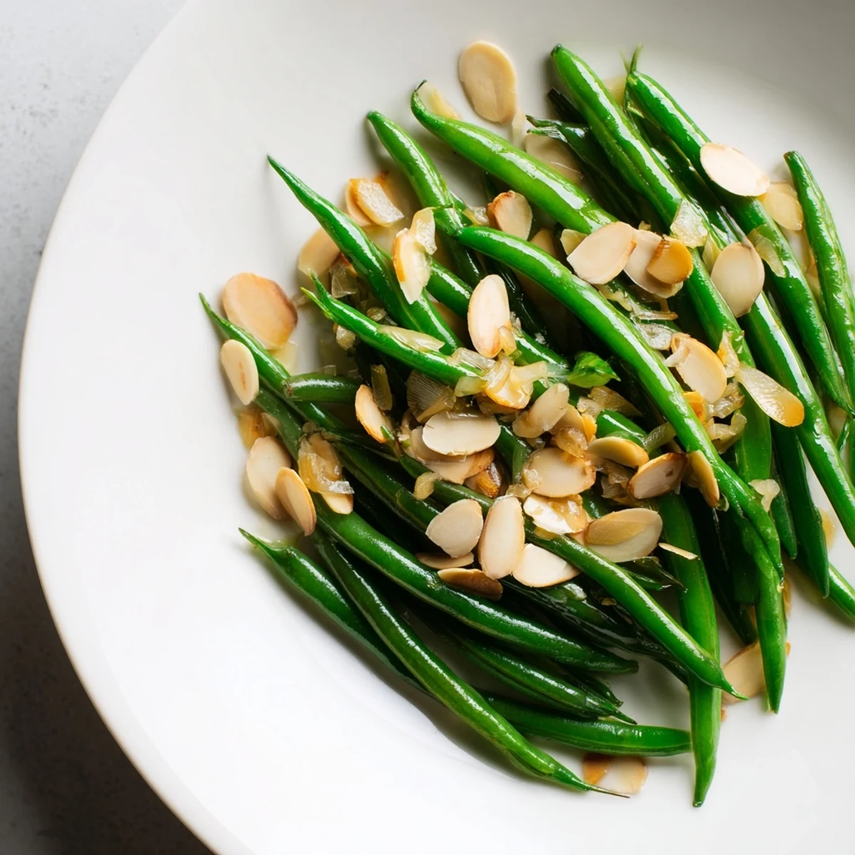 Enjoy the delicious crunch of Sautéed Green Beans with Garlic and Almonds; a simple side ready in minutes.