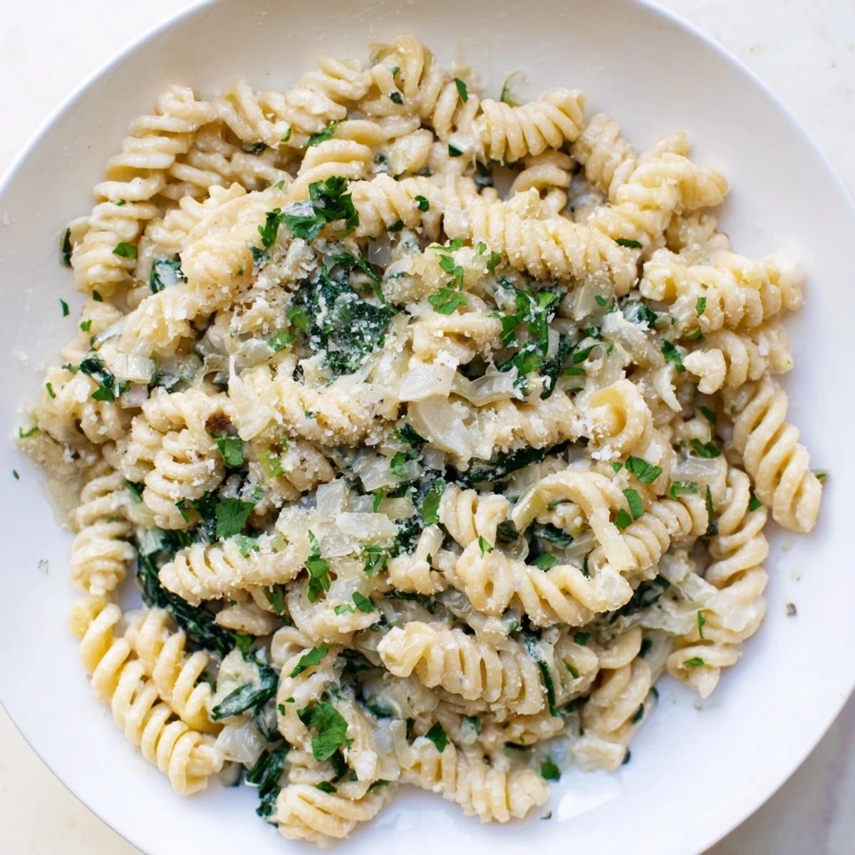 Beautiful close-up of The Magic Casserole: Creamy Spinach Pasta, showcasing tender pasta and creamy sauce.