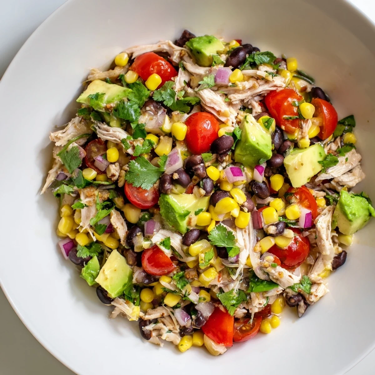 Close up view of the finished Dense Southwestern Bean Salad, perfect for a gathering.