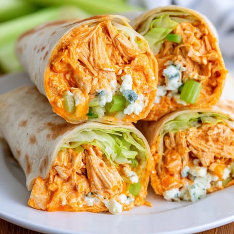 Buffalo Chicken Dip Wrap: A close-up showcases the handheld wraps, a creamy, spicy delight ready to eat.