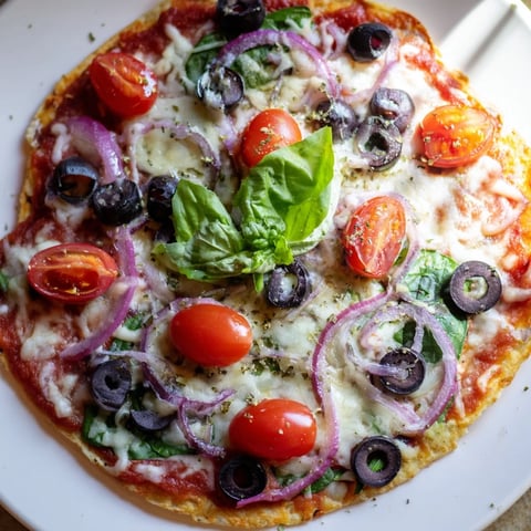 Golden and crispy tortilla pizza topped with melted mozzarella and fresh tomato slices.