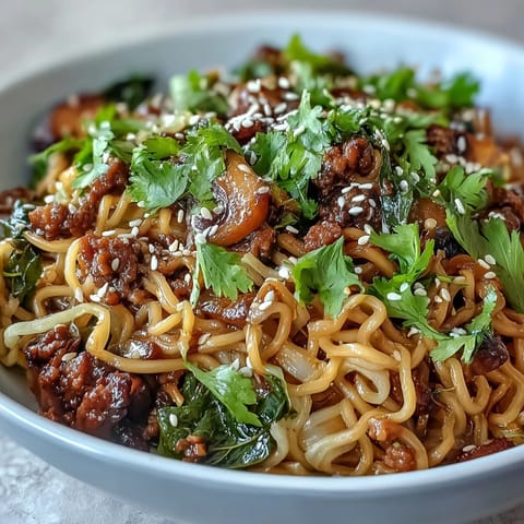A close-up of Potsticker Noodle Bowls highlights golden pork, bean sprouts, and sesame seeds, garnished with cilantro and lime wedges.
