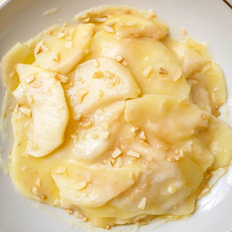 Homemade Rustic Apple Pie, featuring tender apples and a creamy, golden custard base, ready to enjoy.