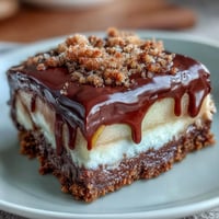 Sweet apple slices dipped in rich chocolate and topped with crunchy graham cracker crumbs and gooey marshmallow — a fun twist on s'mores.